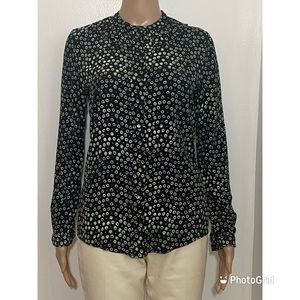 A.P.C Long sleeve blouse in black and white print. Ruffled trim at band collar.